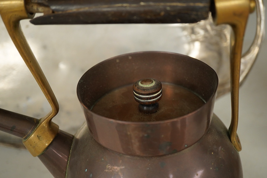 An Arts and crafts copper and brass Benham & Froud stamped Christopher Dresser teapot, (A.F), together with a two handle tray stamped Torini &Sons, Tray 49cm wide.